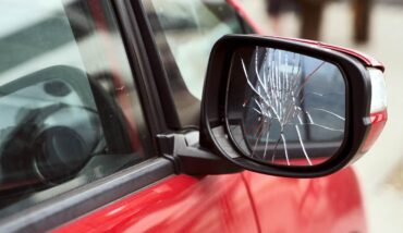 Car with broken side mirror