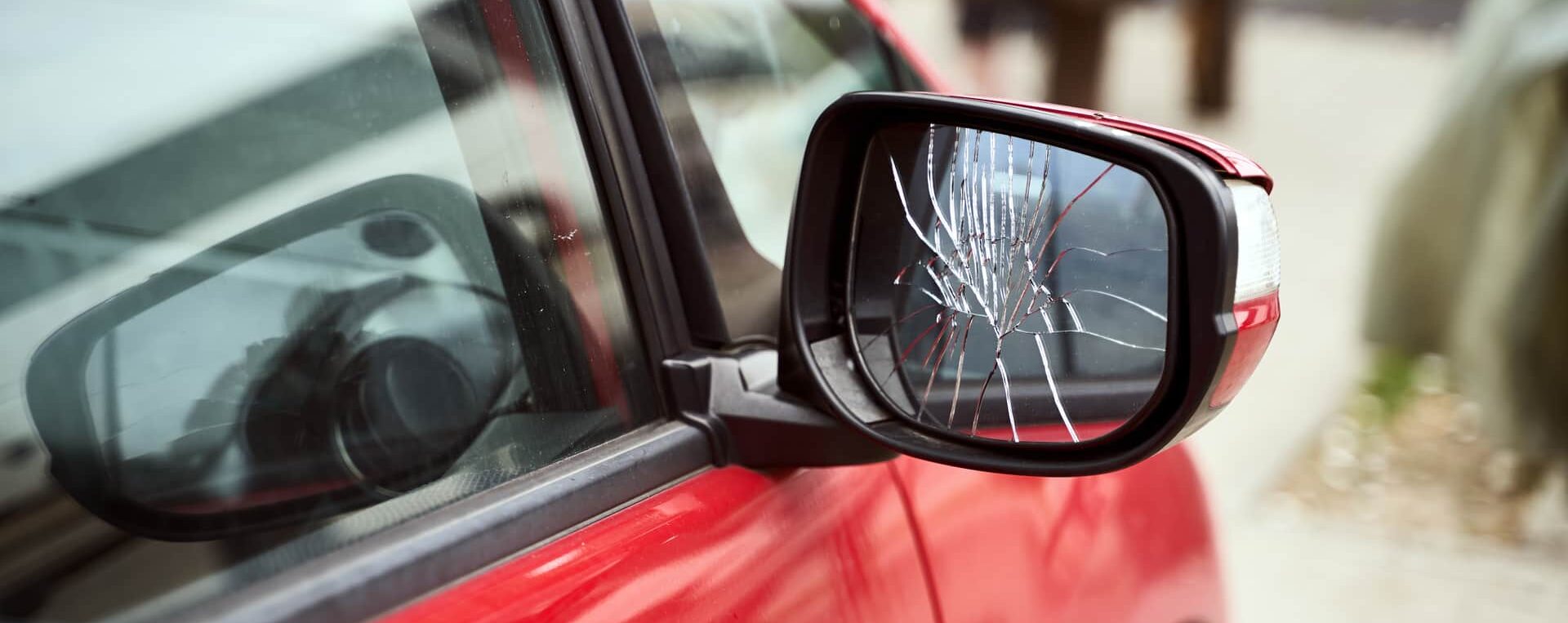 Car with broken side mirror